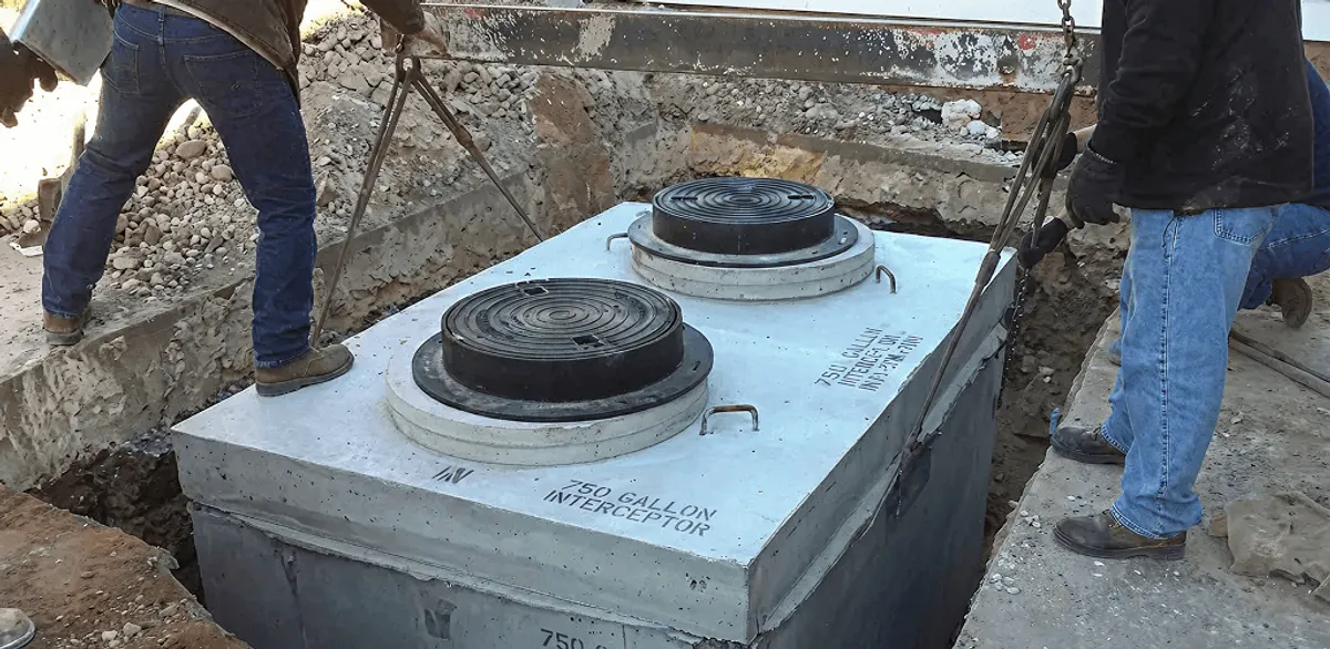 Grease trap installation for a commercial property drainage system in Cedar Rapids, IA