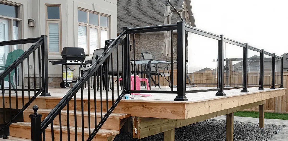 Handrail installation on a deck staircase for safety and code compliance in Cedar Rapids, IA